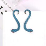 Wholesale snake earrings featuring white zircon pave and green eyes on real gold plated copper from JuneJewelry.com.