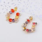 Wholesale pastel crystal earrings with multicolored oval zircon and 925 silver pins from JuneJewelry.com – luxury fashion jewelry for bulk orders.
