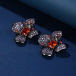 Wholesale flower zircon earrings with pink and yellow crystals on 18K gold plated brass from JuneJewelry.com – luxury floral jewelry for bulk purchase.