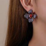 Wholesale flower zircon earrings with pink and yellow crystals on 18K gold plated brass from JuneJewelry.com – luxury floral jewelry for bulk purchase.