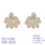 Wholesale flower zircon earrings with white pavé crystals on real gold plated copper from JuneJewelry.com – luxury floral studs for bulk orders.