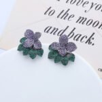 Wholesale flower zircon earrings with white pavé crystals on real gold plated copper from JuneJewelry.com – luxury floral studs for bulk orders.