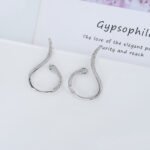 Wholesale serpent hoop earrings with white zircon pavé and green eyes on silver plated copper from JuneJewelry.com – trendy jewelry for bulk orders.