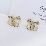 Wholesale leopard stud earrings with white zircon pave and green eyes on silver plated copper from JuneJewelry.com – unique animal jewelry.