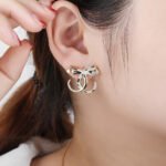 Wholesale leopard stud earrings with white zircon pave and green eyes on silver plated copper from JuneJewelry.com – unique animal jewelry.