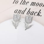 Wholesale tulip zircon earrings with white pave crystals on real gold plated copper from JuneJewelry.com – luxury floral studs.