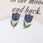 Wholesale tulip zircon earrings with white pave crystals on real gold plated copper from JuneJewelry.com – luxury floral studs.