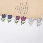 Wholesale tulip zircon earrings with white pave crystals on real gold plated copper from JuneJewelry.com – luxury floral studs.
