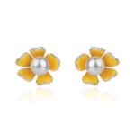 Wholesale pearl flower earrings with lavender enamel petals and zircons on 14K gold plated brass from JuneJewelry.com – unique floral jewelry for bulk purchase.