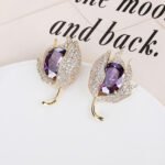 Wholesale purple tulip earrings with oval zircon and 925 silver needles from JuneJewelry.com – luxury floral brass jewelry for bulk orders.
