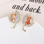 Wholesale purple tulip earrings with oval zircon and 925 silver needles from JuneJewelry.com – luxury floral brass jewelry for bulk orders.