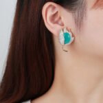 Wholesale purple tulip earrings with oval zircon and 925 silver needles from JuneJewelry.com – luxury floral brass jewelry for bulk orders.