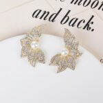 Wholesale butterfly pearl earrings with zircon pave and gold plated copper from JuneJewelry.com – luxury 925 silver needle fashion jewelry for bulk orders.