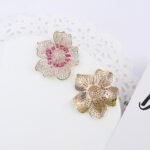 Wholesale luxury zircon earrings with flower and leopard designs on real gold plated copper from JuneJewelry.com – premium fashion jewelry for bulk buyers.