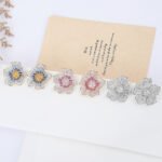 Wholesale luxury zircon earrings with flower and leopard designs on real gold plated copper from JuneJewelry.com – premium fashion jewelry for bulk buyers.