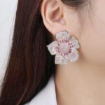 Wholesale luxury zircon earrings with flower and leopard designs on real gold plated copper from JuneJewelry.com – premium fashion jewelry for bulk buyers.