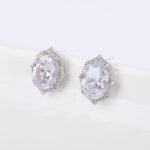 Wholesale geometric zircon earrings with large oval center stones and 925 silver needles from JuneJewelry.com – luxury bridal fashion jewelry for bulk purchase.