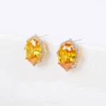 Wholesale geometric zircon earrings with large oval center stones and 925 silver needles from JuneJewelry.com – luxury bridal fashion jewelry for bulk purchase.