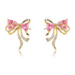Wholesale Pink Ribbon Earrings with trillion-cut pink crystals and 925 silver needles on gold plated brass from JuneJewelry.com.