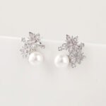 Wholesale flower pearl earrings with shimmering cubic zirconia petals and 925 silver needles from JuneJewelry.com – elegant floral jewelry for bulk purchase.