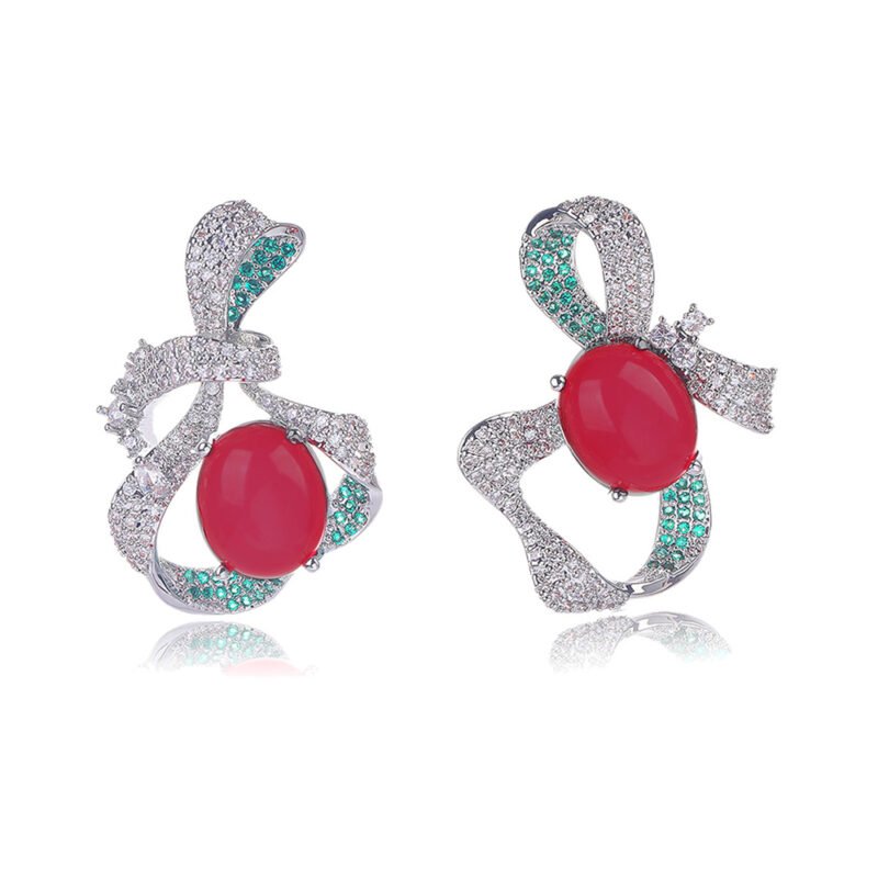 Wholesale red ribbon earrings with green zircons and 925 silver needles from JuneJewelry.com – unique bow-knot fashion jewelry for bulk buyers.