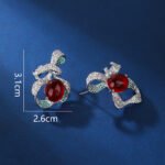 Wholesale red ribbon earrings with green zircons and 925 silver needles from JuneJewelry.com – unique bow-knot fashion jewelry for bulk buyers.