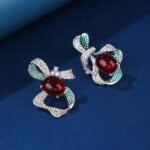 Wholesale red ribbon earrings with green zircons and 925 silver needles from JuneJewelry.com – unique bow-knot fashion jewelry for bulk buyers.