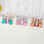 Wholesale butterfly zircon earrings with colorful stones and 925 silver pins from JuneJewelry.com – premium fashion jewelry for bulk orders.