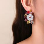 Wholesale floral zircon earrings with colorful red and yellow stones on gold plated copper from JuneJewelry.com – unique flower jewelry for bulk orders.