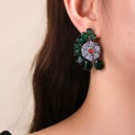 Wholesale floral zircon earrings with colorful red and yellow stones on gold plated copper from JuneJewelry.com – unique flower jewelry for bulk orders.