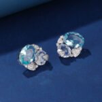 Wholesale blue zircon earrings with sky-blue oval stones and 925 silver needles from JuneJewelry.com – luxury nautical fashion jewelry for bulk buyers.