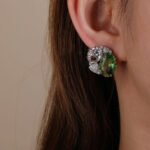 Wholesale blue zircon earrings with sky-blue oval stones and 925 silver needles from JuneJewelry.com – luxury nautical fashion jewelry for bulk buyers.