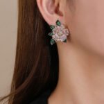 Wholesale floral zircon earrings featuring rose and blossom designs on real gold plated copper from JuneJewelry.com – luxury fashion jewelry for bulk orders.