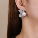 Wholesale floral pearl earrings with cubic zirconia petals and 925 silver needles from JuneJewelry.com – elegant flower jewelry for bulk orders.