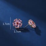 Wholesale pink flower earrings with heart-shaped zircon and 925 silver pins from JuneJewelry.com – cherry blossom fashion jewelry for bulk orders.