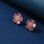 Wholesale pink zircon earrings with heart-shaped petals and 925 silver pins on gold plated copper from JuneJewelry.com – romantic flower jewelry for bulk orders.