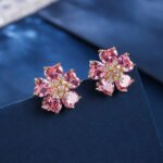 Wholesale pink zircon earrings with heart-shaped petals and 925 silver pins on gold plated copper from JuneJewelry.com – romantic flower jewelry for bulk orders.