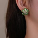 Wholesale pink zircon earrings with heart-shaped petals and 925 silver pins on gold plated copper from JuneJewelry.com – romantic flower jewelry for bulk orders.