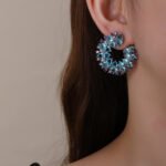 Wholesale yellow zircon hoop earrings with pink accents on real gold plated copper from JuneJewelry.com – luxury fashion jewelry for bulk buyers.