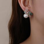Wholesale floral pearl earrings with multicolored cubic zirconia and 925 silver needles from JuneJewelry.com – luxury jewelry for bulk orders.