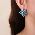 Wholesale multicolor flower earrings with red, blue, and yellow zircons on 14K gold plated brass from JuneJewelry.com – luxury floral jewelry for bulk orders.