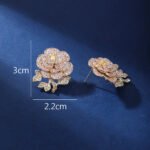 Wholesale flower zircon earrings with white pave petals on real gold plated copper from JuneJewelry.com – luxury floral jewelry for bulk orders.