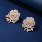 Wholesale flower zircon earrings with white pave petals on real gold plated copper from JuneJewelry.com – luxury floral jewelry for bulk orders.