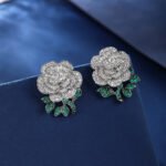 Wholesale flower zircon earrings with white pave petals on real gold plated copper from JuneJewelry.com – luxury floral jewelry for bulk orders.