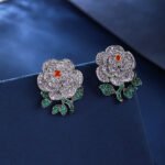 Wholesale flower zircon earrings with white pave petals on real gold plated copper from JuneJewelry.com – luxury floral jewelry for bulk orders.
