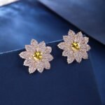 Wholesale red heart earrings with white zircon flower petals and 925 silver pins from JuneJewelry.com – luxury bridal jewelry for bulk orders.