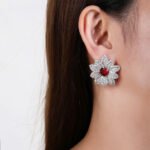 Wholesale red heart earrings with white zircon flower petals and 925 silver pins from JuneJewelry.com – luxury bridal jewelry for bulk orders.