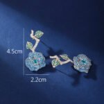 Wholesale snake zircon earrings with white pave stones on real gold plated copper from JuneJewelry.com – unique serpent fashion jewelry for bulk orders.