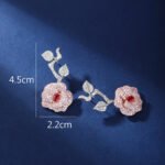 Wholesale snake zircon earrings with white pave stones on real gold plated copper from JuneJewelry.com – unique serpent fashion jewelry for bulk orders.