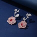 Wholesale snake zircon earrings with white pave stones on real gold plated copper from JuneJewelry.com – unique serpent fashion jewelry for bulk orders.